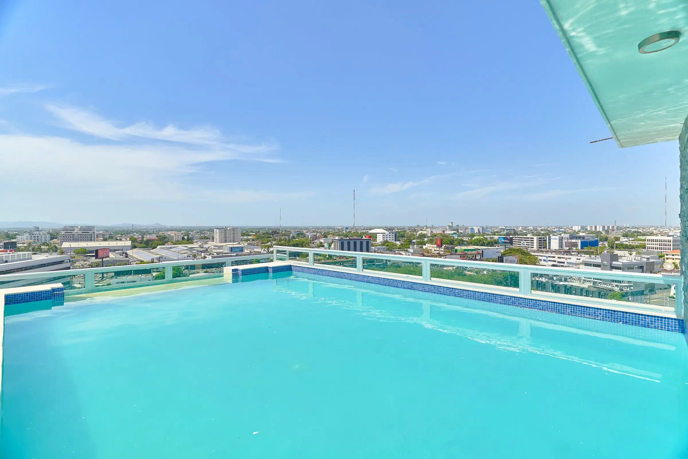 Rooftop swimming pool of Central Suites Tower overlooking Santo Domingo