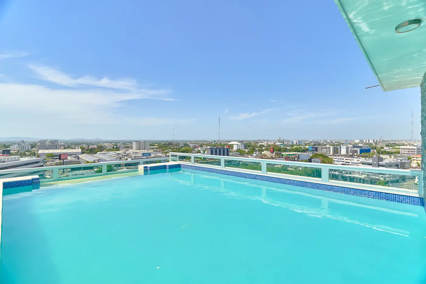 Rooftop swimming pool of Central Suites Tower overlooking Santo Domingo